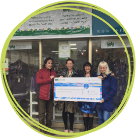 Receiving-a-cheque-outside-the-CHSW-shop-in-Nailsea